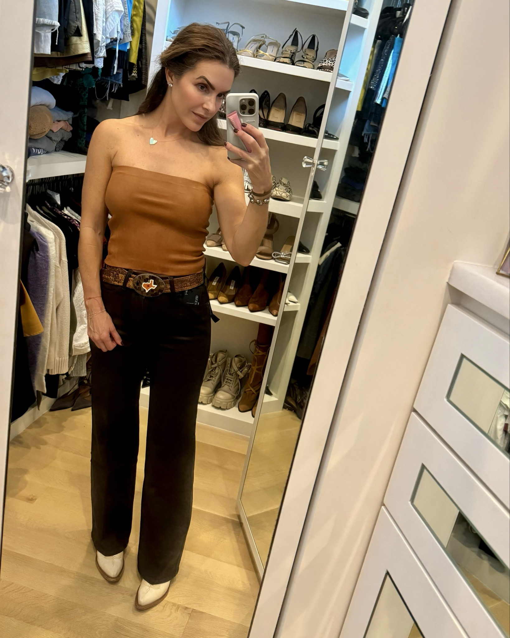 looking for a fab #thanksgivingoutfit i’ve got you covered with these gorgeous chocolate brown coated jeans (that also come in black)🤎 along w a fab leather top & my fav boots i own in sm colors too! 

is it cool where you are? then just add a blazer or jacket over your shoulders to complete the look! 

jeans run slightly big i sized down to a 25 (they have some stretch, so if bt sizes i would size down) & top runs tts im wearing a small 

#gamedayoutfit #fallfamilyphotos #countryconcertoutfit #boots #jeans 

#LTKSeasonal #LTKHoliday #LTKShoeCrush