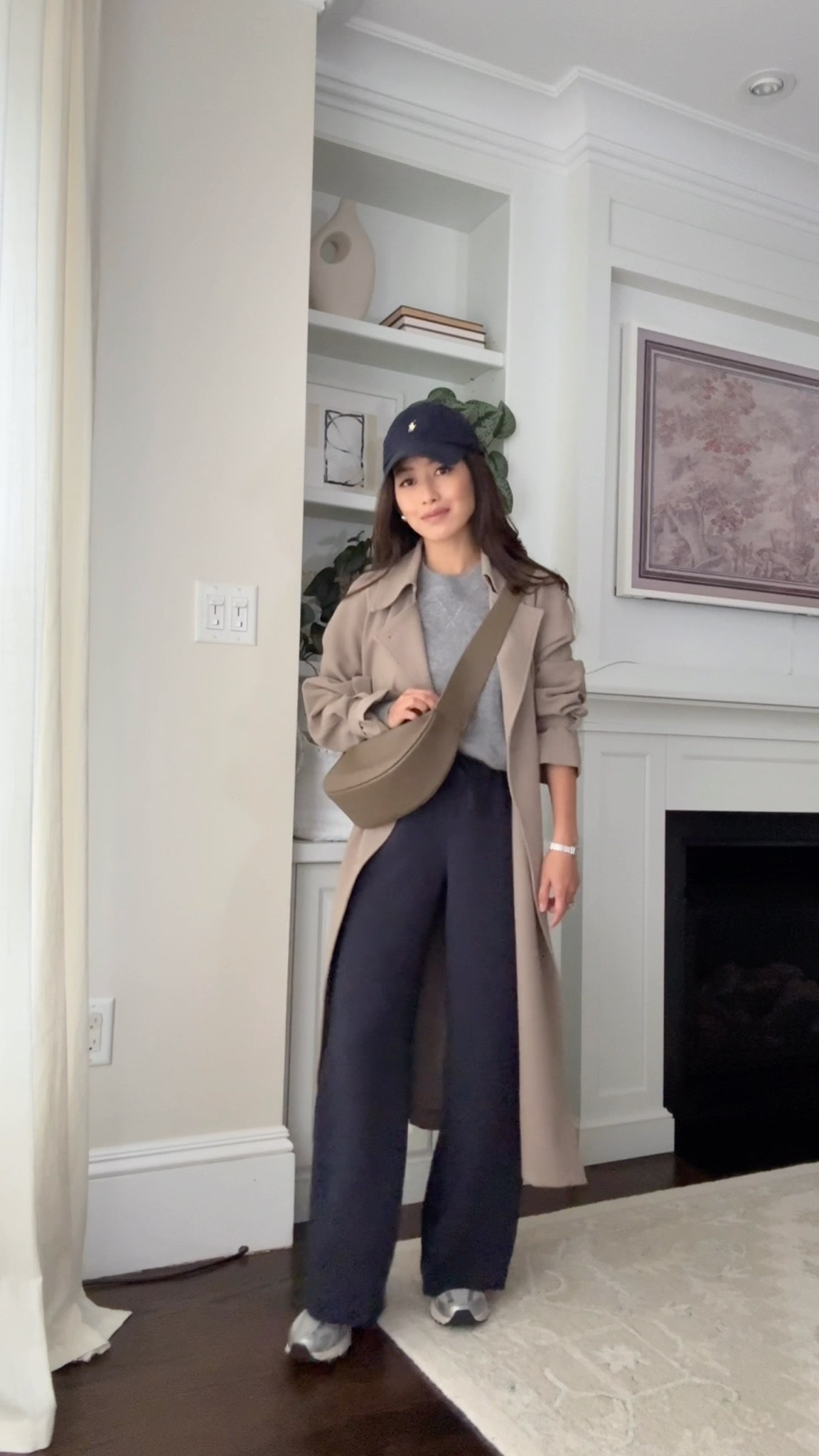 Easy travel / mom on the go outfit featuring our favorite pull on pants 

• Aritzia lodge trousers 2XS short these are amazing! Drapey fluid fabric that isn’t thin, stretch waist, wrinkle resistant 

• Oak + Fort trench coat xxs - use code JEANTRENCH for 15% off. Very loose fit (runs pretty big, hits past midi length on me (5ft)). The material has a nice weight and drapes well 

• Quince Mongolian shrunken cashmere sweatshirt xs, lightweight sweater in lots of colors, smaller petite friendly fit and banded bottom so you don’t have to tuck

• homestretch rib tee XS sized up 

• New Balance 530 - a big kids 4 = womens 5.5/6

• Amazon leather crossbody bag

• Polo hat

Smart casual outfit, bsuy mom casual outfit looks, airport travel style, petite friendly 

#LTKmomlife #LTKTravel #LTKPetite