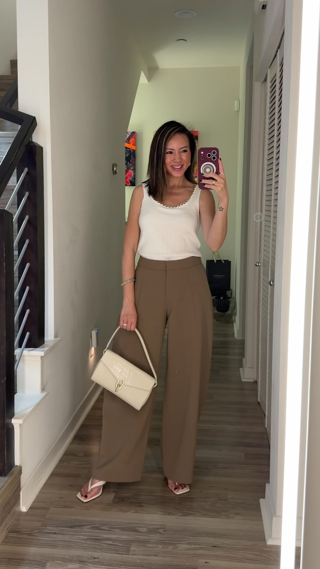 OOTD ⚡️ What I wore to go meet a client. This gold chain kni top is edgy and chic. It’s lightweight and the perfect staple for spring and summer. Styled with these chic barrel trousers that are wrinkle free. You sold out these thong sandals last year. It’s back in stock and are so comfortable! Plus they’re under $50. 

Spring outfit, ootd, workwear, work outfit, trousers, knit top, sandals, kitten heels, The Stylizt 



#LTKWorkwear #LTKootd #LTKstorytime