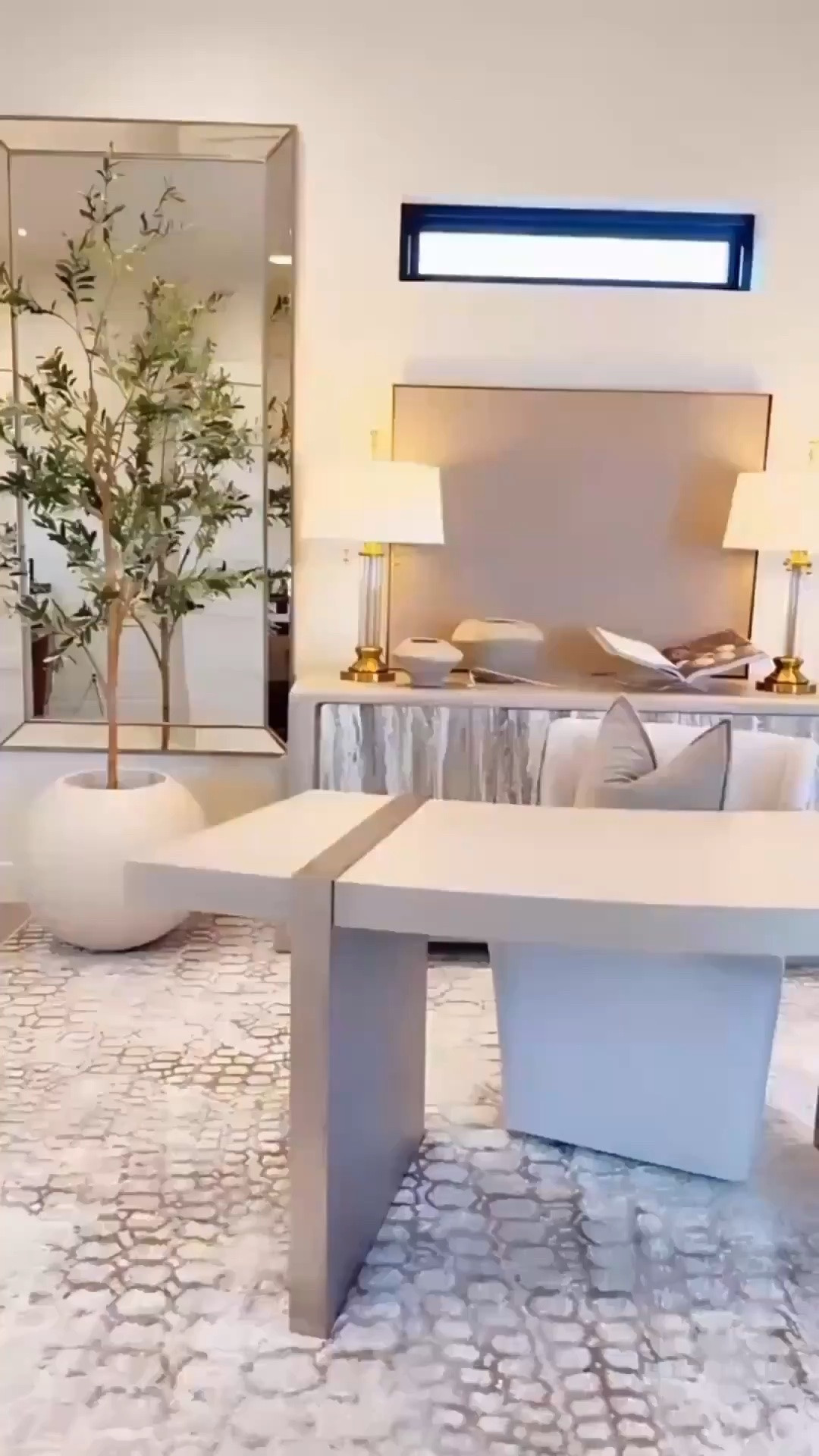 It was so fun making over this space 🤍 I absolutely love how it turned out. The rug has the perfect creams, browns and grey/silvers, the mirrors make the room feel larger and I love the bedded details, and the olive trees were such an affordable way to bring in the perfect touch of green. The lamps are even prettier in person, the desk is simply beautiful, and the light fixture is one of my favorite pieces. I’ve also been loving motorized Roman shades lately!! They add such a soft, elevated feel to the whole space. 🤍 amazon home decor neutral home decor designer inspired office office makeover decor on a budget 

Summerthompsonstyles

#LTKHome #LTKSaleAlert