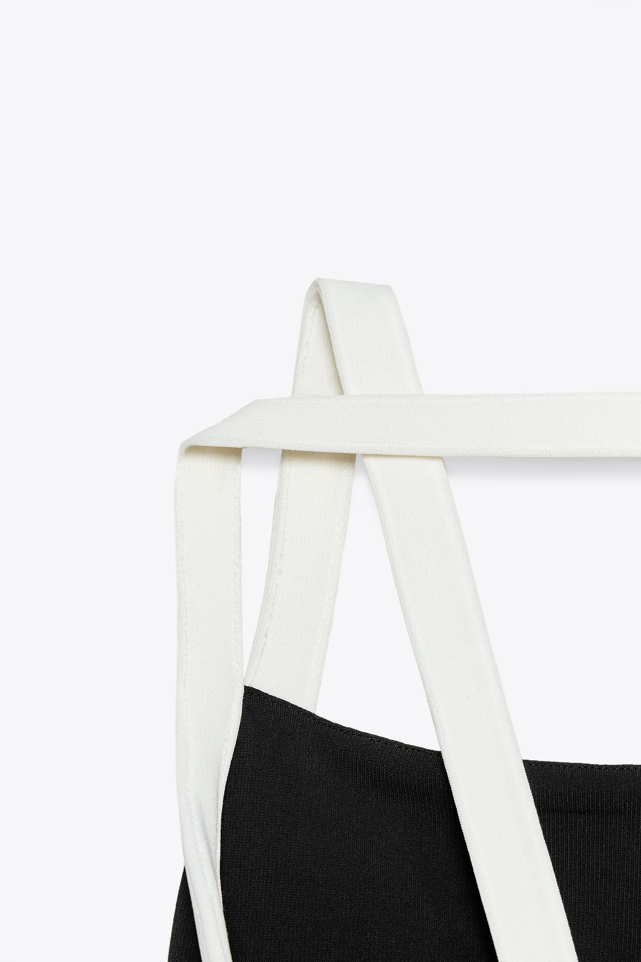 Vestito midi confezionato in tessuto elasticizzato. Collo halter con spalline in tessuto a contra... | Zara IT