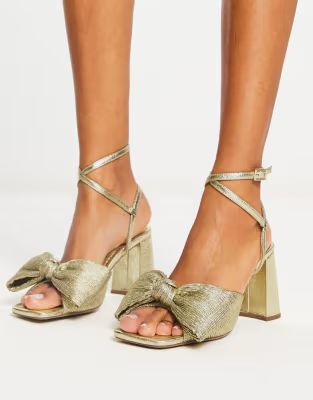 ASOS DESIGN Hitched bow detail mid heeled sandals in gold | ASOS (Global)