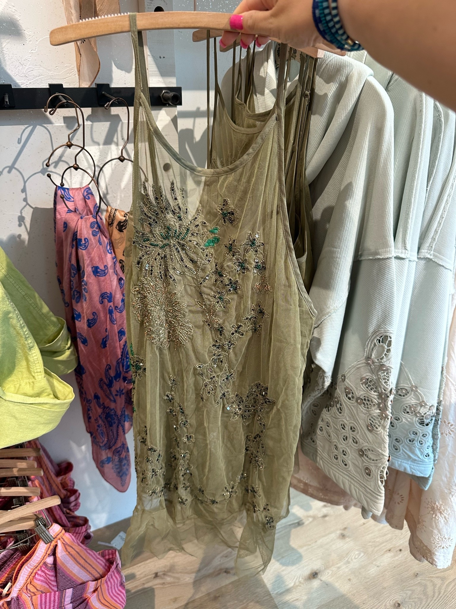Love this green beaded slip dress! I think this would be so cute to layer with for a country concert! It ranges from sizes XS-XL & is priced at $168! Straps are adjustable!

#LTKMidsize #LTKPetite