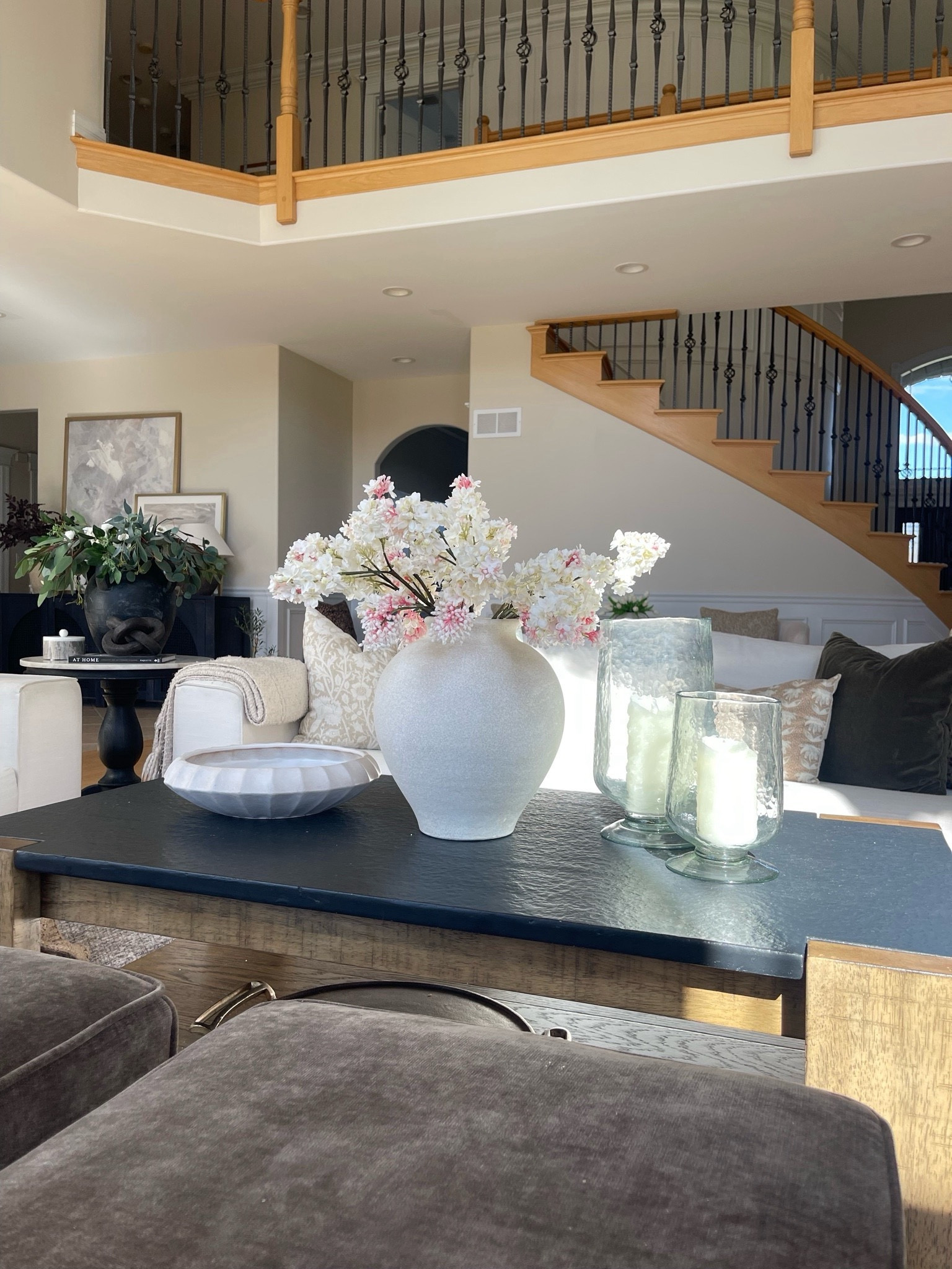 Coffee table styling for summer. Loving these candle holders so much. The glass is so beautiful. This vase is stunning, neutral and has a little texture. And this bowl is my favorite. 

#LTKHome #LTKSaleAlert