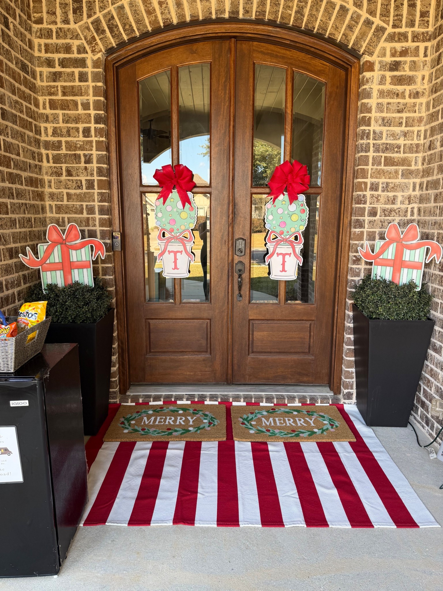 Front porch refresh for Christmas! Planters and rug are Amazon and other rugs are Target! Door signs are by one love yard signs on insta! 

#LTKFindsUnder100 #LTKHome #LTKHoliday
