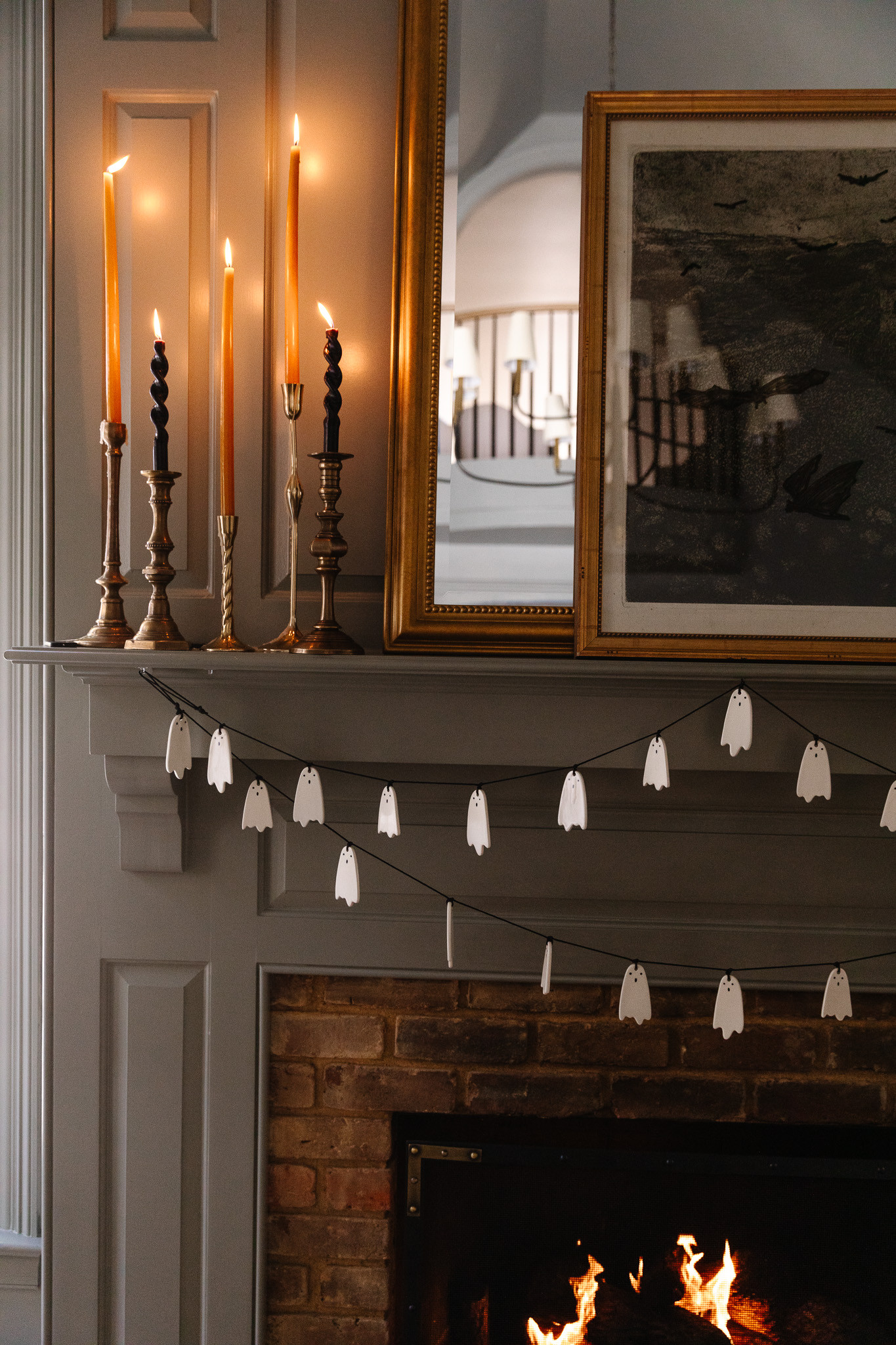 #AD Halloween decor that still feels like it belongs in our house. We started with an oversized bronze frame and filled in around it: a white figurine garland, LED pillar candles that drip like real wax (minus the mess), a little cloche moment, and a few black animal figurines tucked here and there. It’s spooky in a way you’d actually want to look at all month. Everything here is from Wayfair and linked so you can recreate it this week. @wayfair #wayfair #WayfairPartner 
 

 #LTKSeasonal #LTKHome