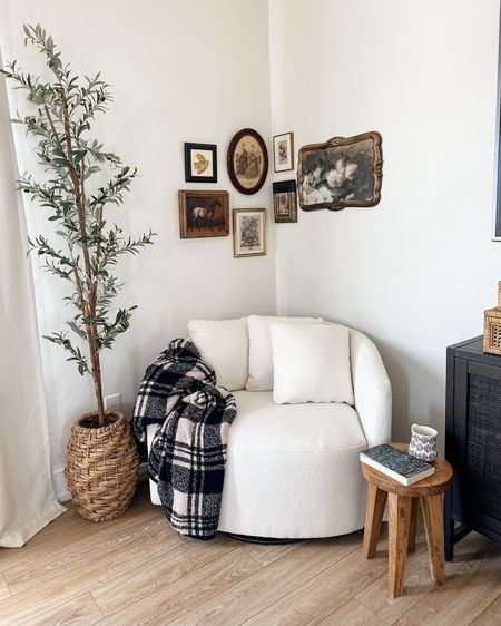 Cozy corner
Reading nook
Beautiful round white swivel chair
Olive tree
Accent table stool
Vintage wall

#LTKhome #LTKxTarget