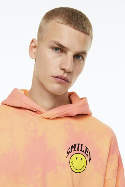 Oversized capuchonsweater met print | H&M (DE, AT, CH, NL, FI)