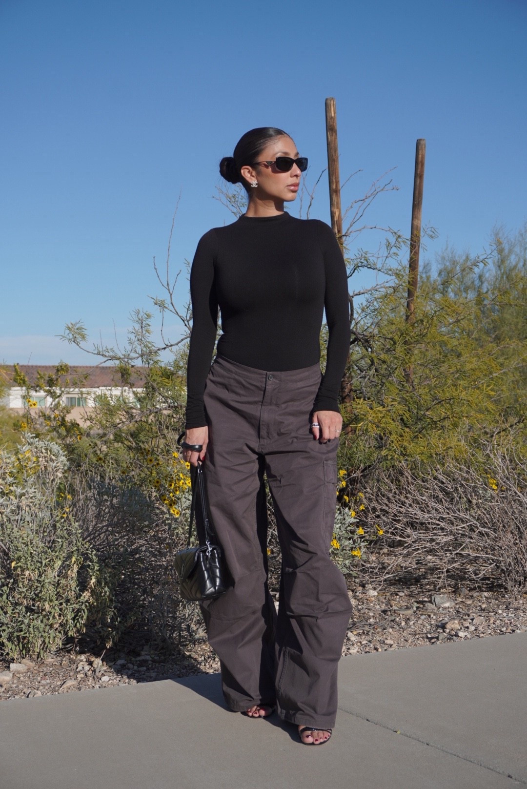 Winter fashion 
Winter outfit 
Sunglasses
Oversized cargo pants
Bodysuit 
Ysl bag 

#LTKootd #LTKNYFW #LTKOver40