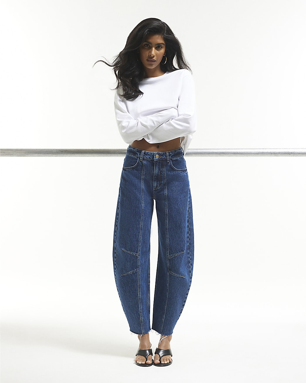 Blue Mid Rise Seamed Raw Hem Barrel Jeans | River Island UK & IE