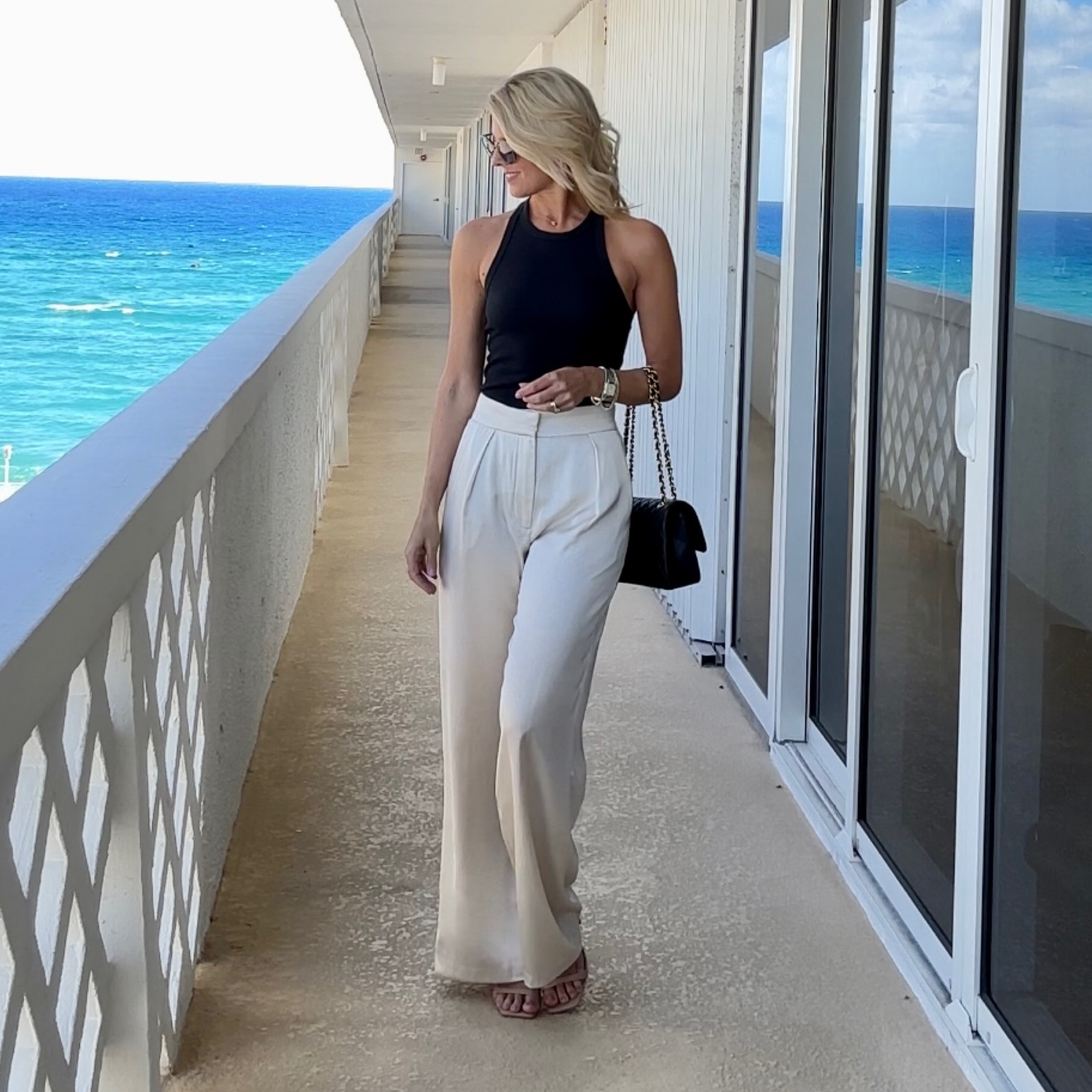 Styling satin pants.     Keeping it simple with nude sandals, a basic black tank and a pretty purse.

#LTKSeasonal #LTKunder100 #LTKFind