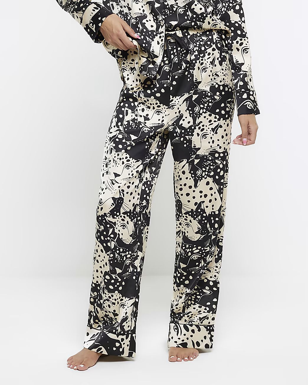 Black satin animal print pyjama trousers | River Island (US)