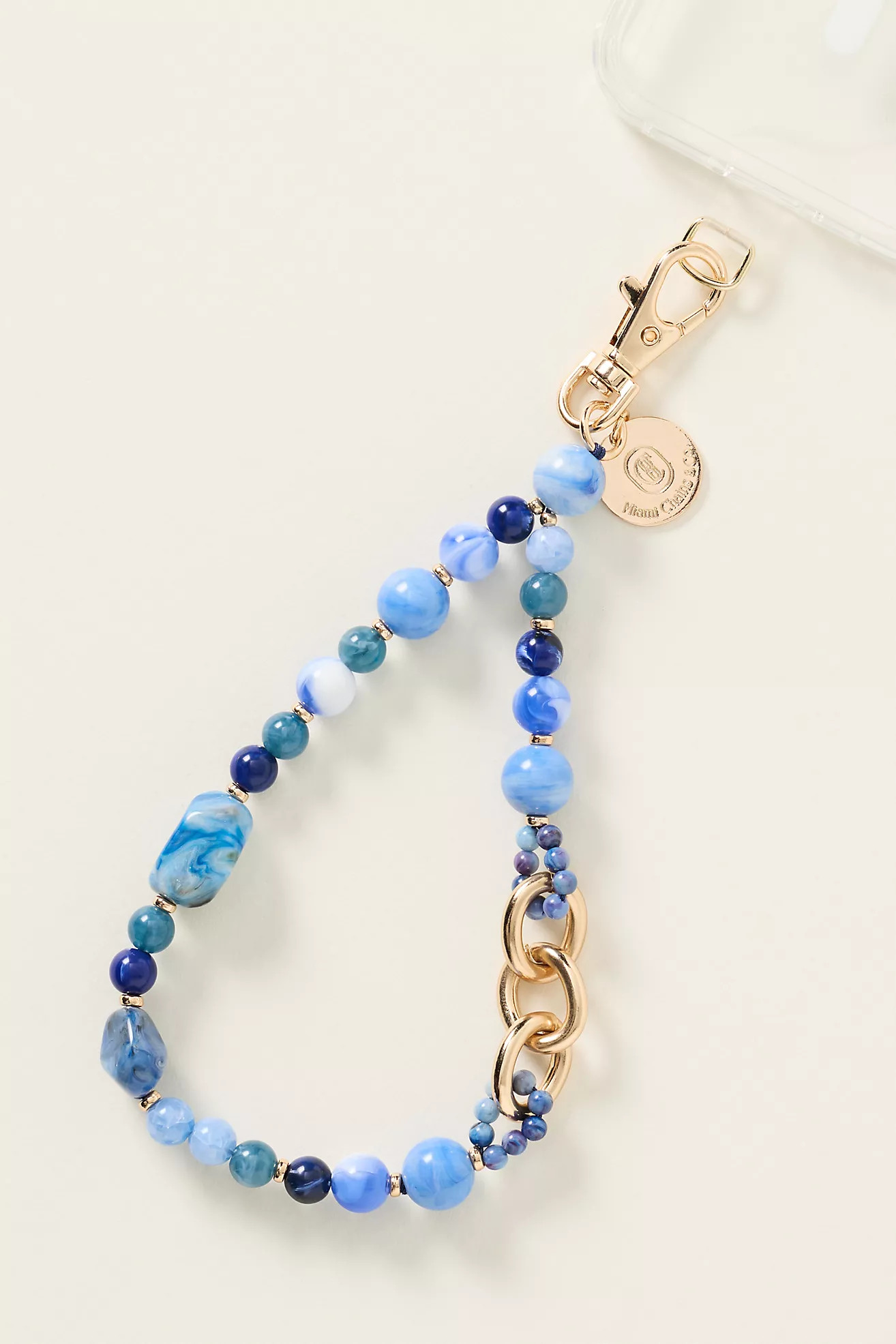 Miami Chains & Co. Zodiac Collection Phone Wristlet | Anthropologie (US)