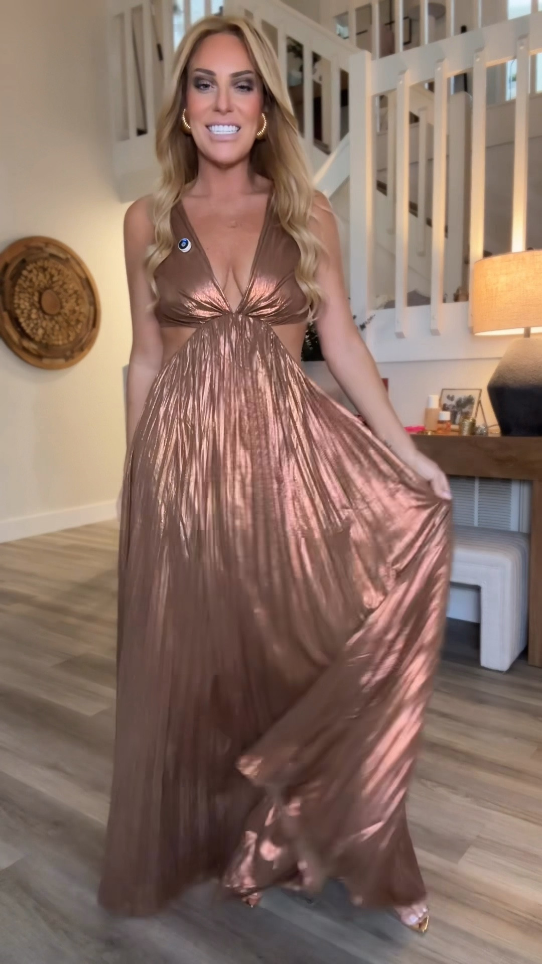 This gown is an absolute showstopper. The bronze pleated fabric catches the light beautifully, and the flow of the skirt gives it that effortless, red-carpet movement. The deep V neckline and side cutouts create such a flattering, elongated shape without feeling over the top. It’s the perfect balance of glam and elegance. If you need a statement dress for a holiday party, wedding, or any special event, this one will have all eyes on you the second you walk in.

#LTKFindsUnder100 #LTKBump #LTKHoliday