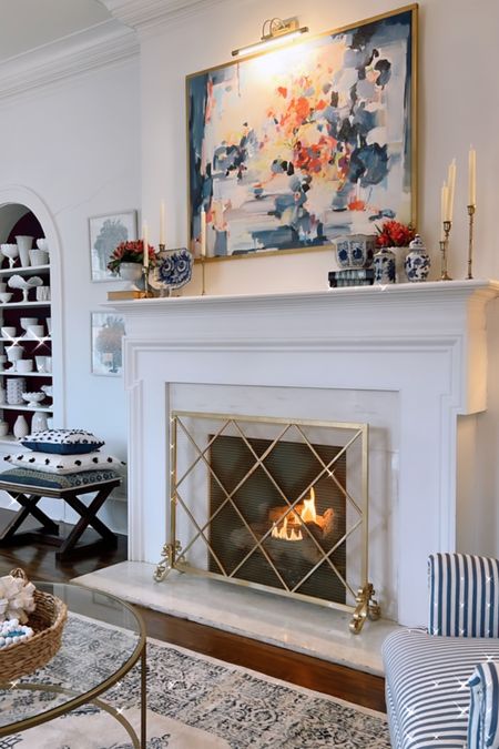 Loving this fireplace screen and all the blue and white.￼

#LTKFind #LTKSeasonal #LTKhome