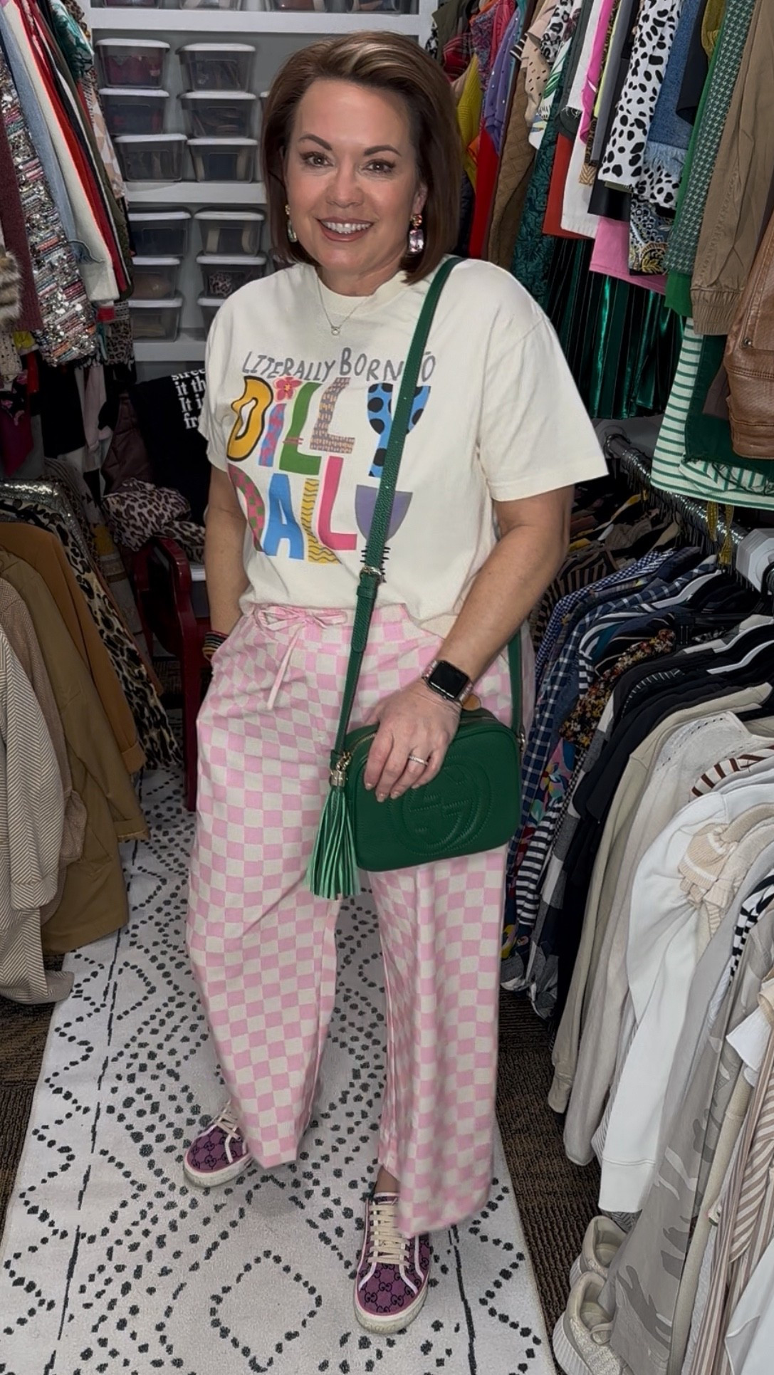 This is your sign to mix patterns and wear the fun pieces. Graphic tee plus pink checkerboard pants creates an easy, feel-good outfit that works for errands, casual days, and weekend plans.

The relaxed graphic tee balances the bold pants perfectly, while the green crossbody adds a pop of contrast that pulls everything together. This is one of those outfits that feels comfortable but still looks intentional, which is always my goal.

Everything is linked so you can recreate the look or mix it with pieces you already own.

⸻

graphic tee outfit, pink checkered pants, checkerboard pants outfit, casual graphic tee outfit, colorful casual outfit, fun everyday outfit, statement pants outfit, pattern mix outfit, pink wide leg pants, pink lounge pants outfit, casual statement pants, comfy printed pants, relaxed fit pants outfit, elastic waist pants, spring summer pants outfit, oversized graphic tee, neutral graphic t shirt, casual cotton tee, graphic tee styling, everyday graphic shirt, green crossbody bag, quilted crossbody purse, tassel crossbody bag, statement handbag outfit, casual outfit accessories, casual sneakers outfit, designer inspired sneakers, everyday walking shoes, fashion sneakers outfit, spring casual outfit, summer casual outfit, weekend outfit ideas, mom casual outfit, errands outfit idea, comfortable everyday outfit, casual chic outfit, playful fashion style, bold color outfit, over 40 casual style, over 50 casual fashion, Amazon casual outfit, affordable statement pants, comfortable fashion finds, casual outfit inspiration, fun fashion for women


#LTKActive #LTKSeasonal #LTKFindsUnder50