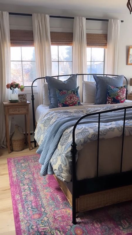 Master Bedroom Spring refresh. Using blues, creams and pinks. Metal bed, rattan shades, linen curtains, waffle weave blanket and floral quilt. 

#LTKunder100 #LTKhome #LTKFind