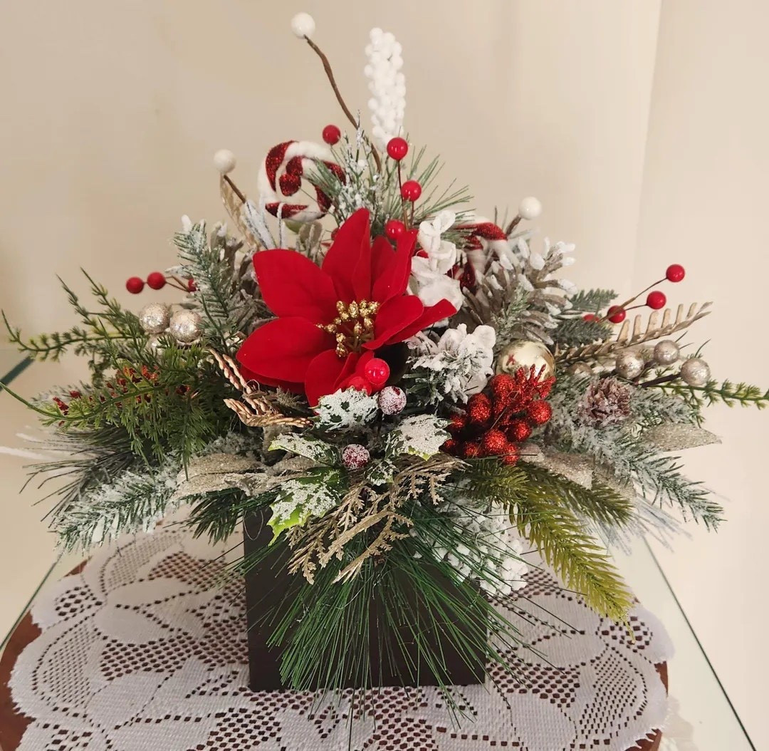 Welcome winter with this beautifully crafted centerpiece from SavvyThree, handmade in Ohio for quicker, more eco-friendly shipping. The arrangement features a rich mix of winter florals and greenery, all perfectly styled in a real 5x5x5 dark walnut–stained wood base that adds warmth and rustic charm. Measuring 16” wide by 13” tall, it’s an eye-catching accent for dining tables, entryways, or gifting to someone special. Each piece is assembled by hand, ensuring a unique, beautifully crafted touch every time. #EtsyFinds #HolidayDecor #WinterCenterpiece #SeasonalStyling #RusticHome #LTKHoliday #LTKHome #SavvyThree

#LTKHoliday #LTKSeasonal #LTKHome