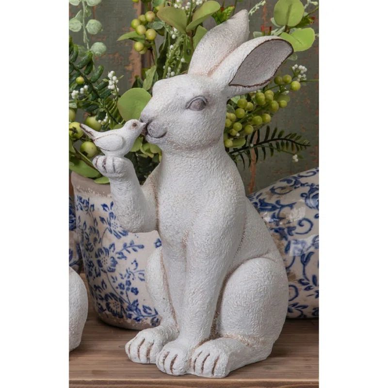 Kinsly Resin Sitting Bunny Holding Bird Figurine | Wayfair Professional