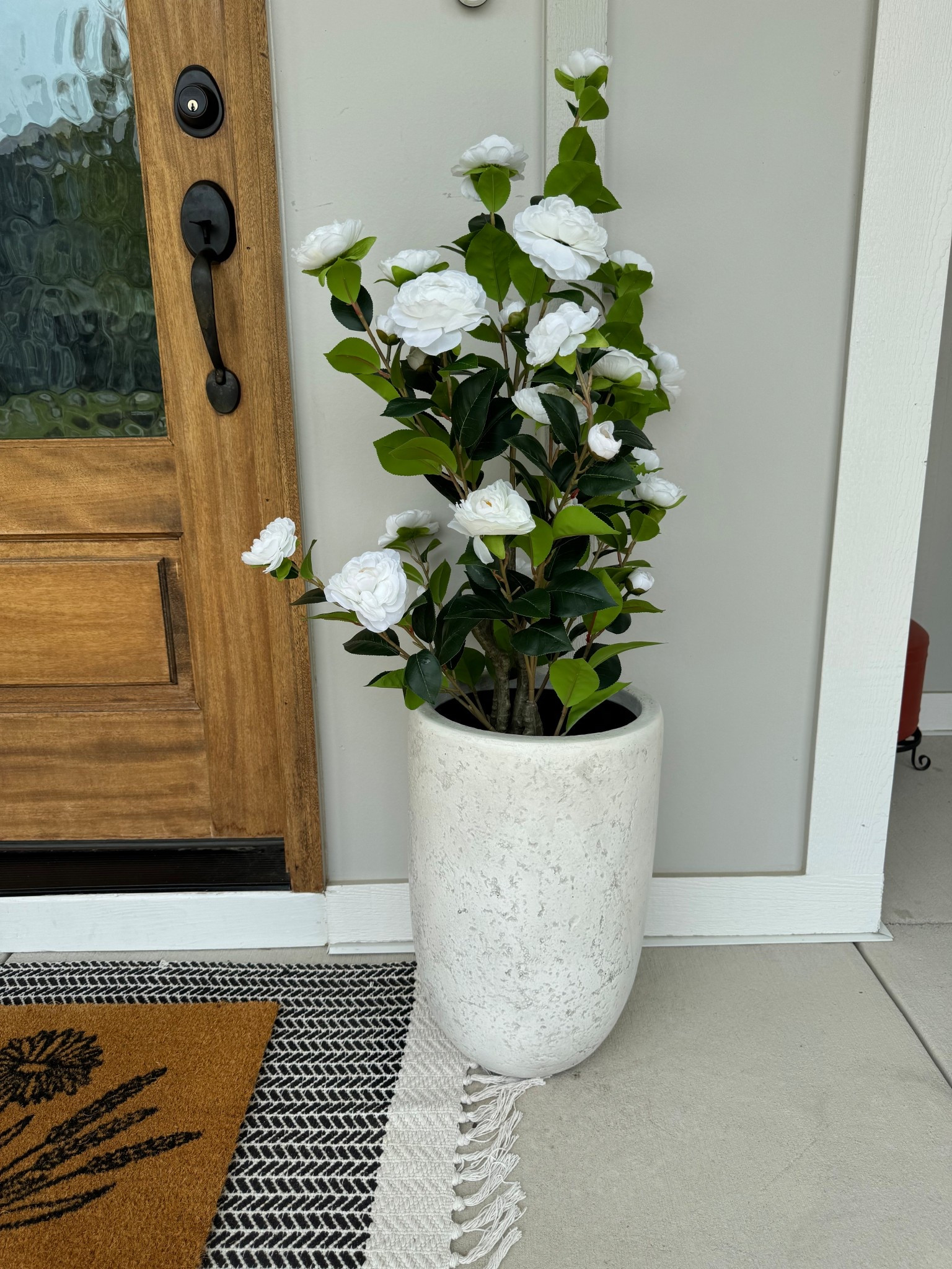 Faux camellia trees, faux porch tree, porch decor, spring porch, spring florals, faux florals, porch ideas, planter, concrete planter, faux plants 

#LTKHome