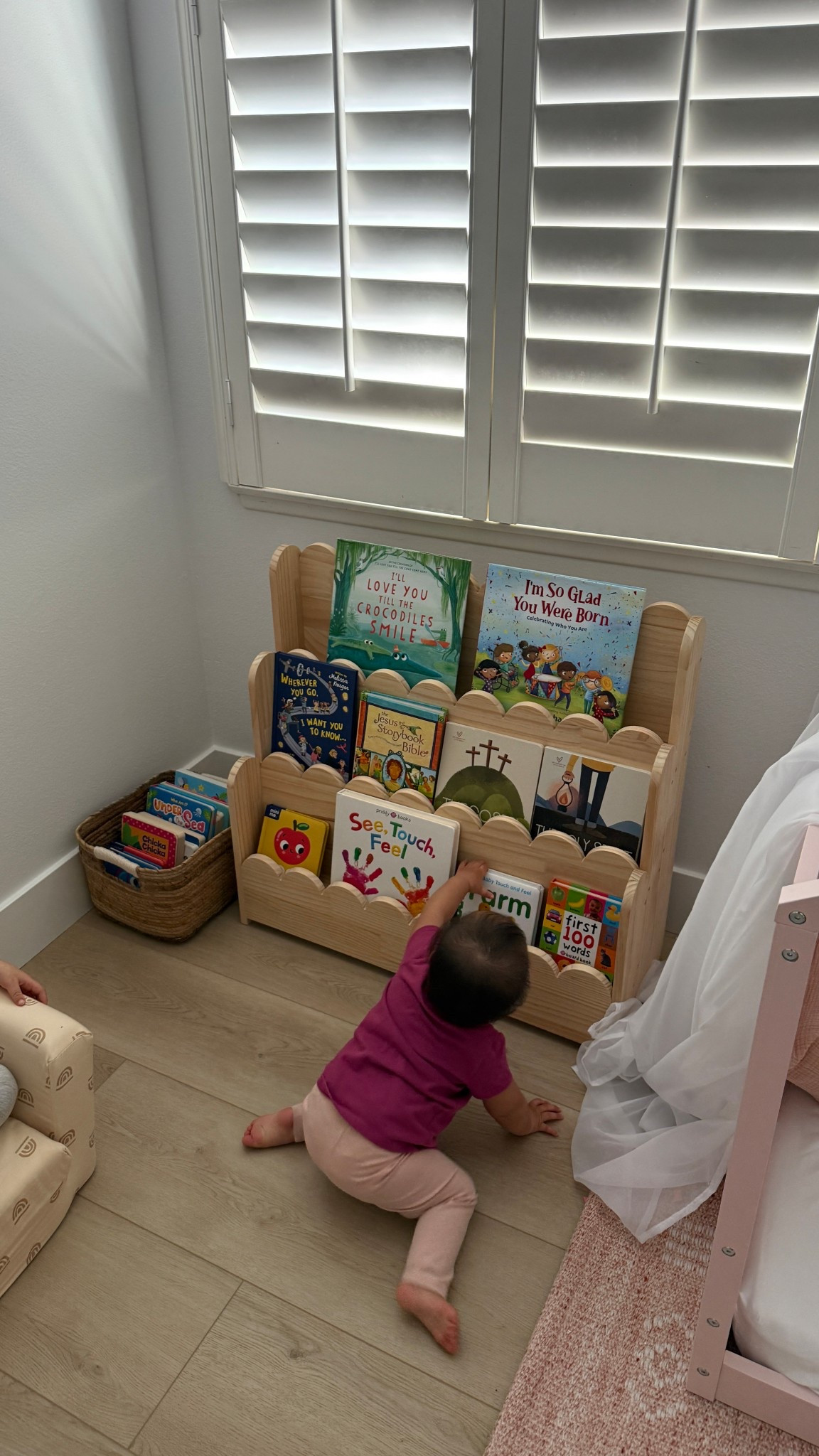 little reading corner with our montessori shelf so my girls can grab books on their own. i also have a basket of books to rotate through! #toddlerbooks #books #bookshelf #homeorganization #targetfinds #amazonfinds 

#LTKKids #LTKmomlife #LTKHome