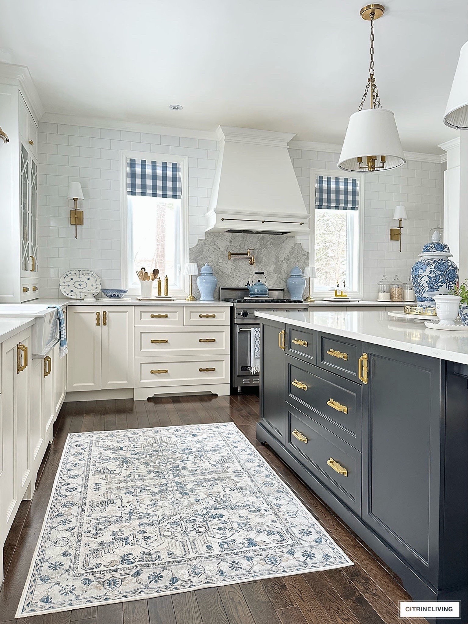 Elegant, chic and classic kitchen decor! Traditional kitchen with brass hardware, pendant lights, oushak rug, brass pot filler, kitchen finds, kitchen decor, kitchen inspiration, gold kitchen finds, gold faucet, gold cabinet pulls, bar stools, kitchen light fixtures, faux plants

#LTKSeasonal #LTKHome