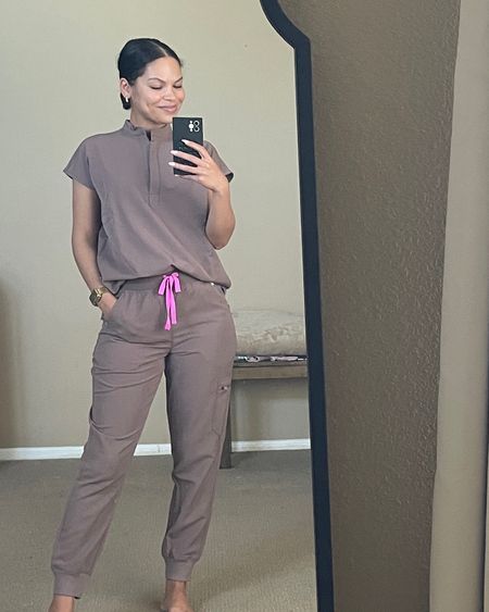 Gorgeous neutral scrubs 🤎 
Color: Smokey Taupe
Top: Rafaela Oversized size XXS (sized down one size)
Bottoms: High Waisted Zamora Joggers size S Petite (sized up one size, I don’t like my bottoms too skin tight and these are slim fit style, my usual XS was tighter than I preferred). 

#LTKworkwear