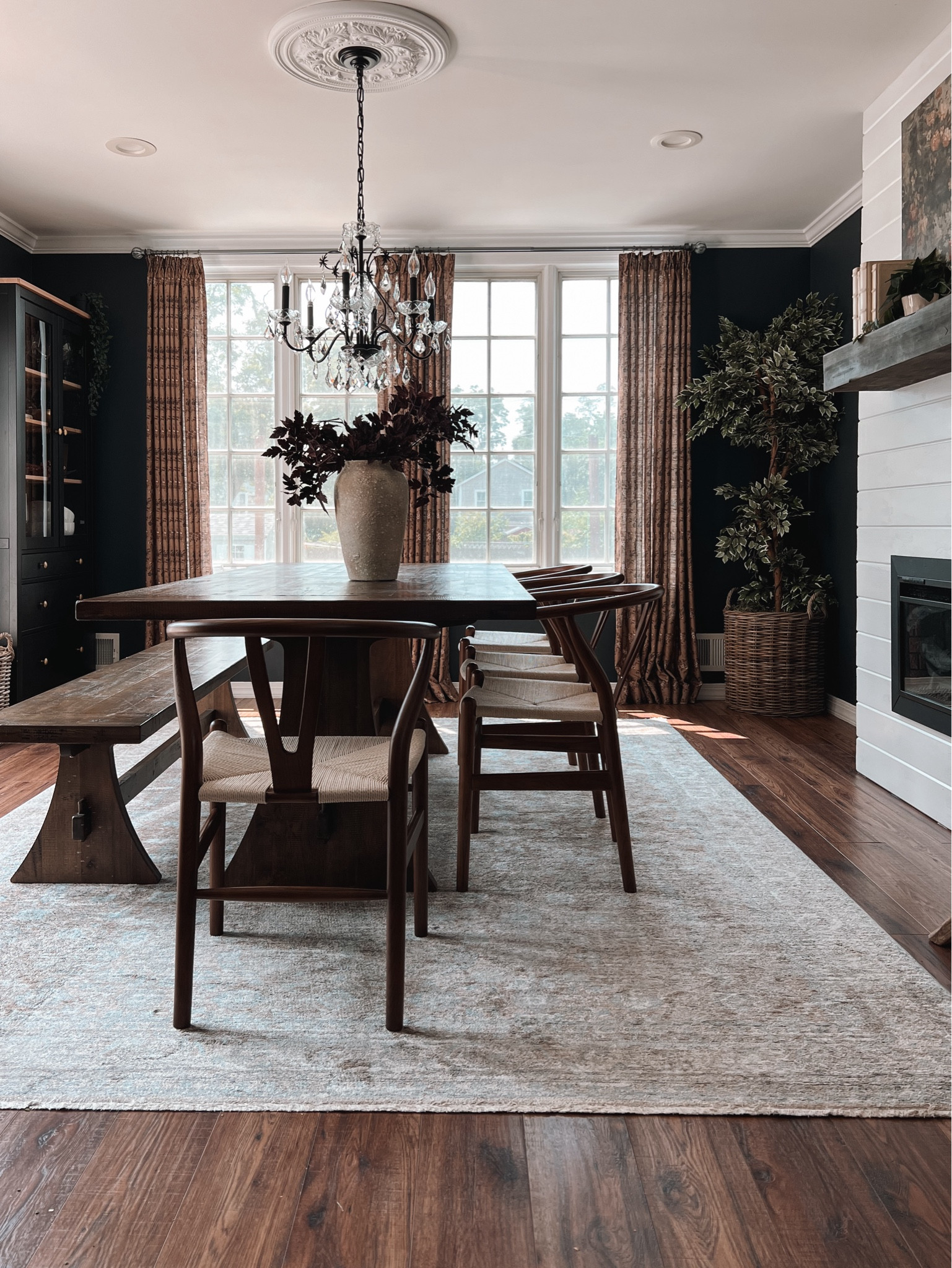 moody with a mid afternoon glow ✨ full disclosure the heat wave really did a number on our hydrangea bushes sooo I pulled these plum stems out of storage and it’s bringing a whole mood in here 🥀  woven & wood chairs are from @eternitymodernhome 🤎 #partner

#LTKHome