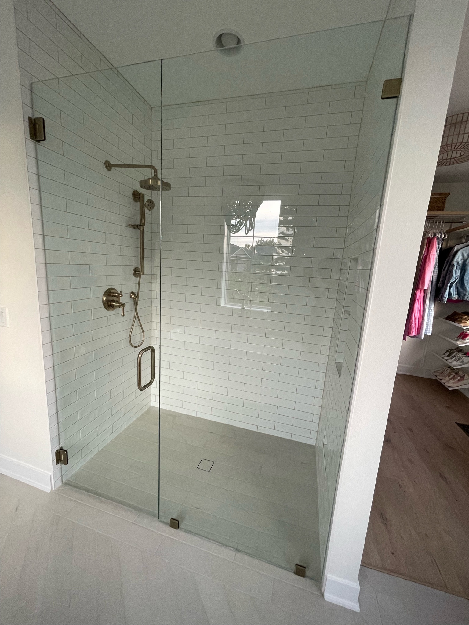 Primary Bathroom Walk in Shower // Delta Champagne Bronze Cassidy Shower Fixtures // Husk Homes // Custom Built Homes of Iowa // Midwest Custom Build // 

#LTKHome
