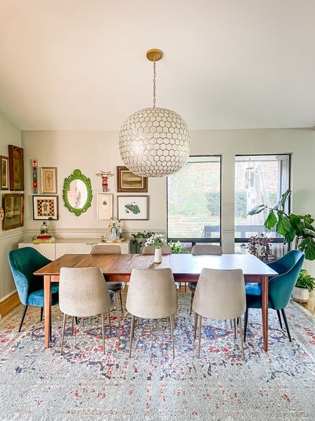 Dining room design. Dining decor. 

West elm chair
Peacock blue chair
Statement Serena & Lily chandelier 
MCM table


#LTKhome #LTKstyletip #LTKfamily