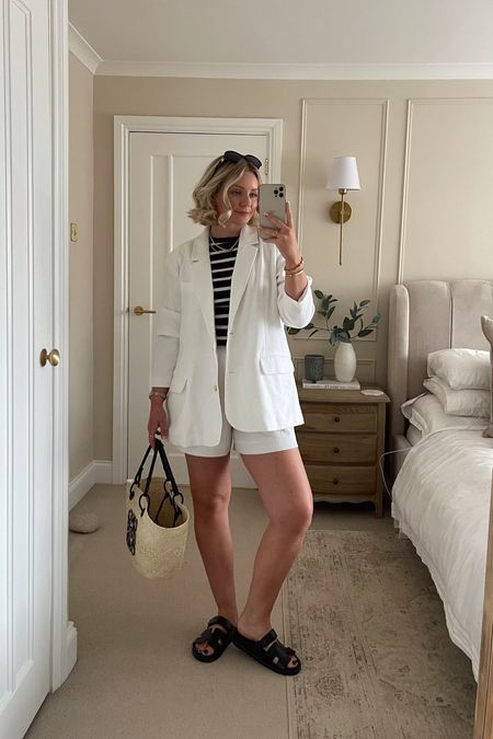 White linen blazer and shorts duo (from Abercrombie, I’m wearing L in blazer and w28 in shorts) styled monochromatically with blazer sandals and a basket bag 🖤 