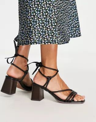 ASOS DESIGN Hollow strappy tie leg mid heeled sandals in black | ASOS (Global)