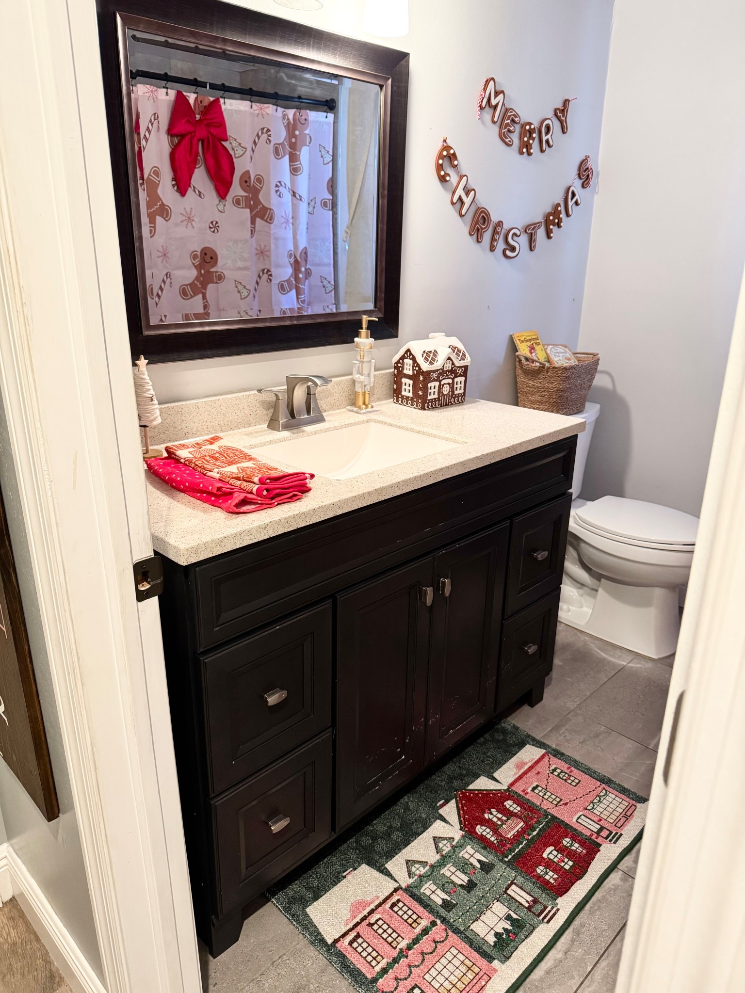 Gingerbread bathroom, Christmas bathroom, gingerbread shower curtain, gingerbread house, gingerbread house rug, red velvet bow, gingerbread towels, Christmas decor 

#LTKHome #LTKHoliday #LTKKids