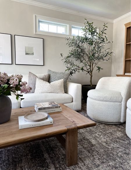 Neutral living room, accent chairs, faux olive tree, coffee table, wood table, faux florals, spring decor, wall art, throw pillows 

#LTKStyleTip #LTKHome