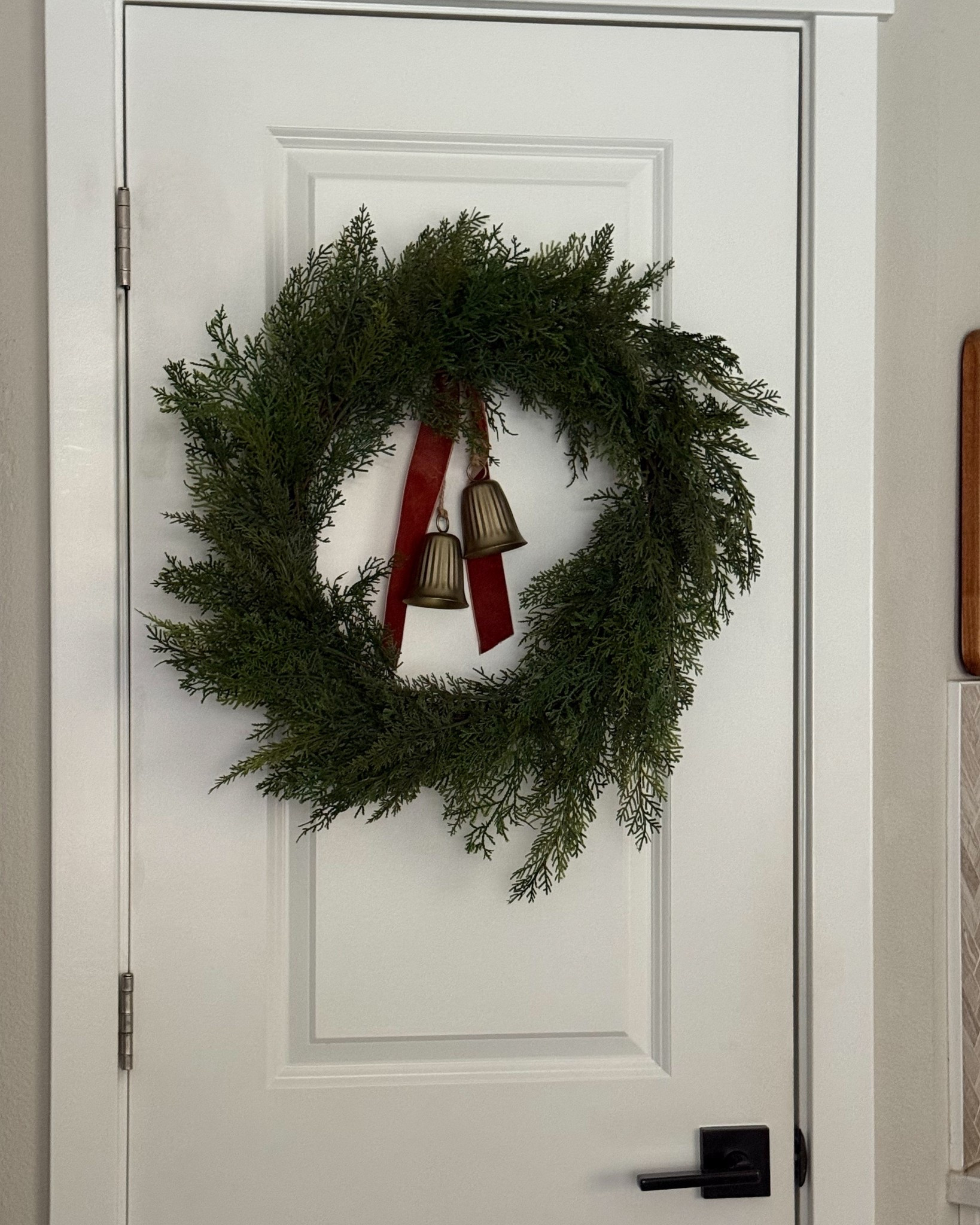 The most beautiful realistic cypress wreath with brass bells! Christmas and holiday decor. 

#LTKHoliday #LTKSeasonal #LTKHome
