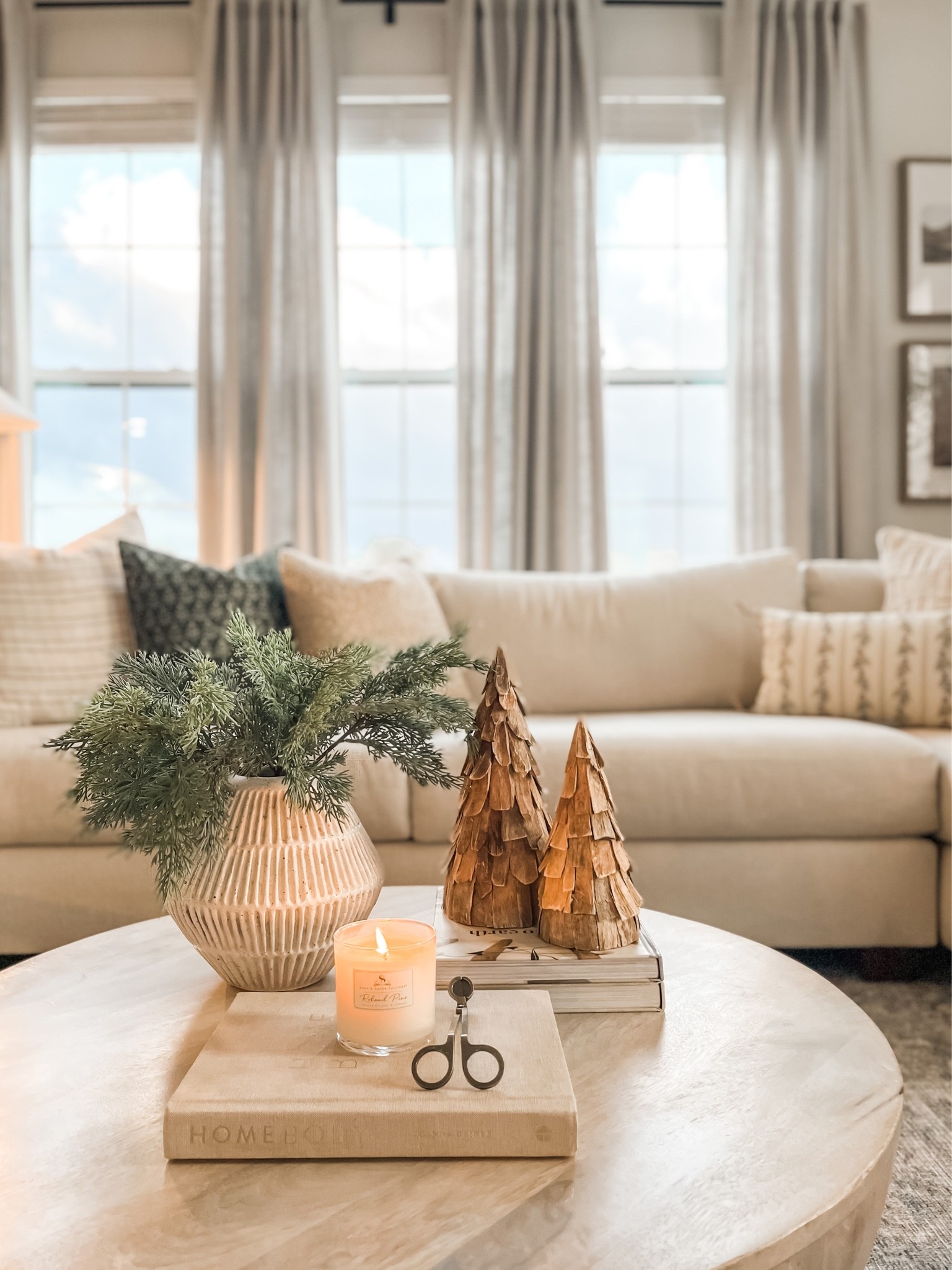 Found my favorite pine scented soy candle! A must try if you love pine scents! 🌲
Coffee table styling, Christmas decor, cedar stems, wooden trees. 

#LTKSeasonal #LTKhome #LTKHoliday