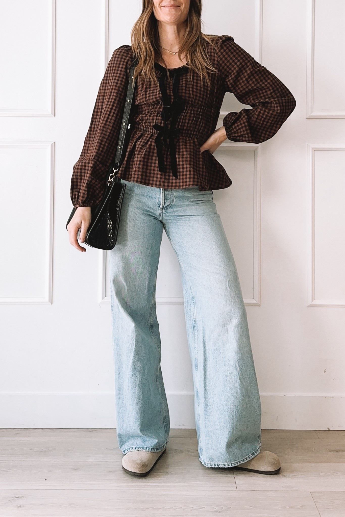 Cozy Fall Outfit: Gingham Peplum Top + Wide Leg Denim

Loving this sweet and simple fall outfit—this gingham peplum top with velvet bows is such a pretty feminine detail, and it pairs perfectly with relaxed wide-leg denim for an easy, everyday look. Styled with suede clogs and my favorite black textured bag.

#LTKootd #LTKgrwm #LTKmomlife