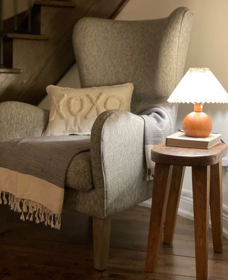 Mini lamp, wingback chair and wooden side table. Paired with the perfect Turkish throw  

#LTKunder100 #LTKhome