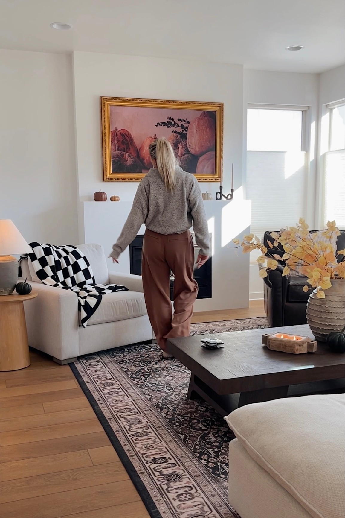 Living room, white tweed couch, leather chair, faux fall leaves, pottery barn, frame tv, brass frame, amazon, checkered blanket, home decor 

#LTKhome #LTKSeasonal