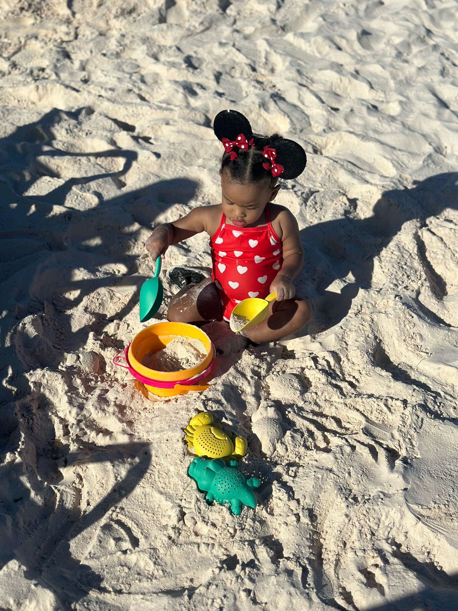 Girl toddler Valentine’s Day heart swimsuit with Mickey Mouse ear hair clips and sand toys 

#LTKBaby #LTKKids #LTKSwim