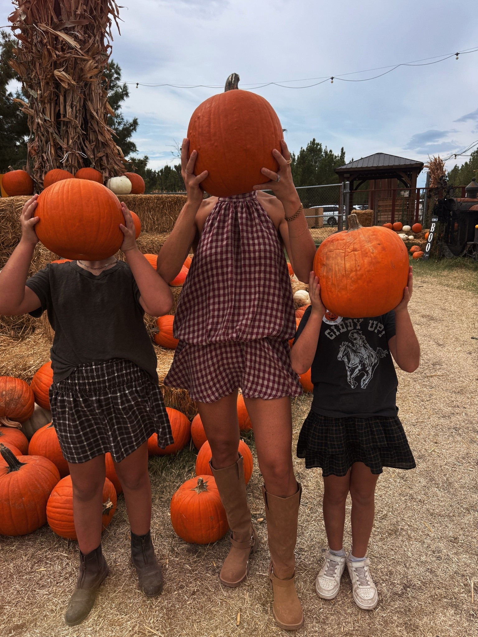 Yearly pumpkin picture with my girls! Sharing our pumpkin patch outfits 

Amazon romper size small
Girls riding boots
Girls plaid skirts