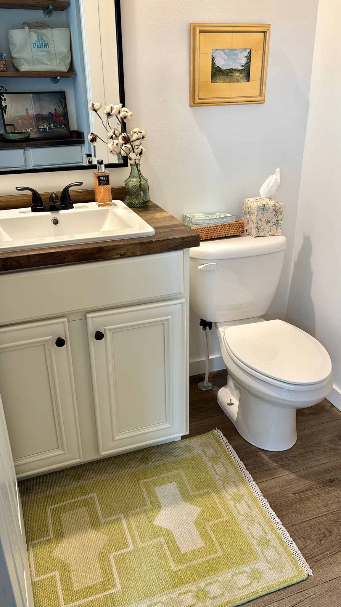 Low-quality photo of our powder bathroom because one of my fav small businesses Milagro Collective is having 20% off their in-stock rugs! Love my little chartreuse Charlene 2x3 here in our powder. The JSH Home painting is another one of my favorite pieces! 

#LTKHome #LTKSaleAlert #LTKSpringSale