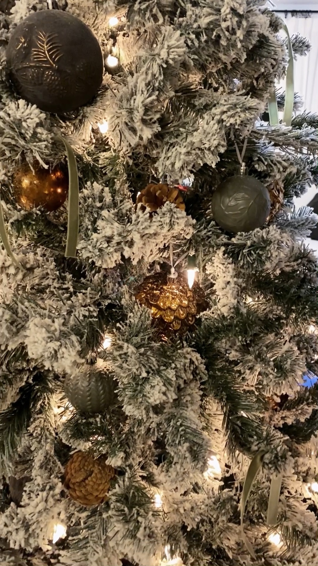 Simple neutral Christmas tree decorations under $50. Flocked tree under $100. Copper Christmas ornaments, green Christmas ornaments, Christmas tree with velvet ribbon and pine cones  

#LTKGiftGuide #LTKhome #LTKstyletip