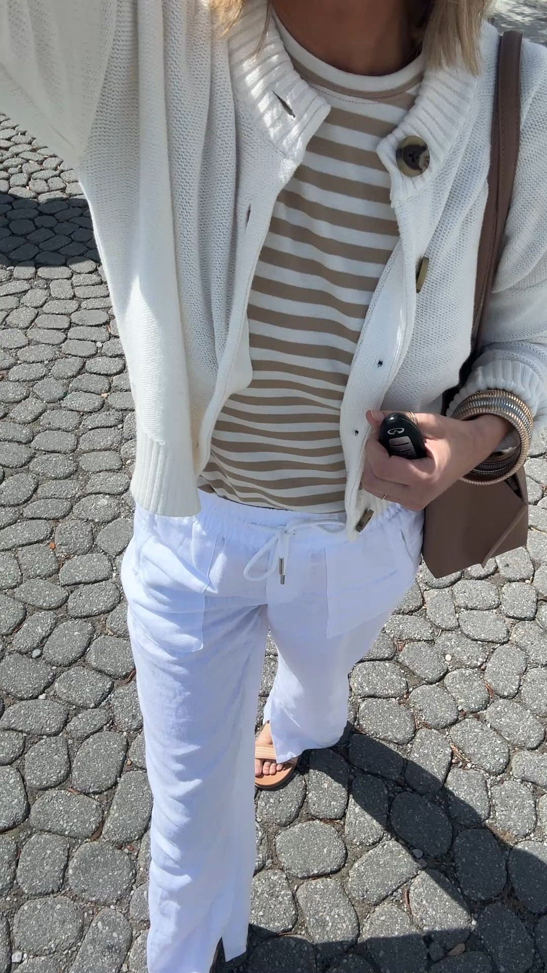 Originally wore this cardigan over my shoulders but a cool breeze was passing through. I am in small tops and small tall white linen pants.  

#LTKover40 #LTKsalealert #LTKtravel