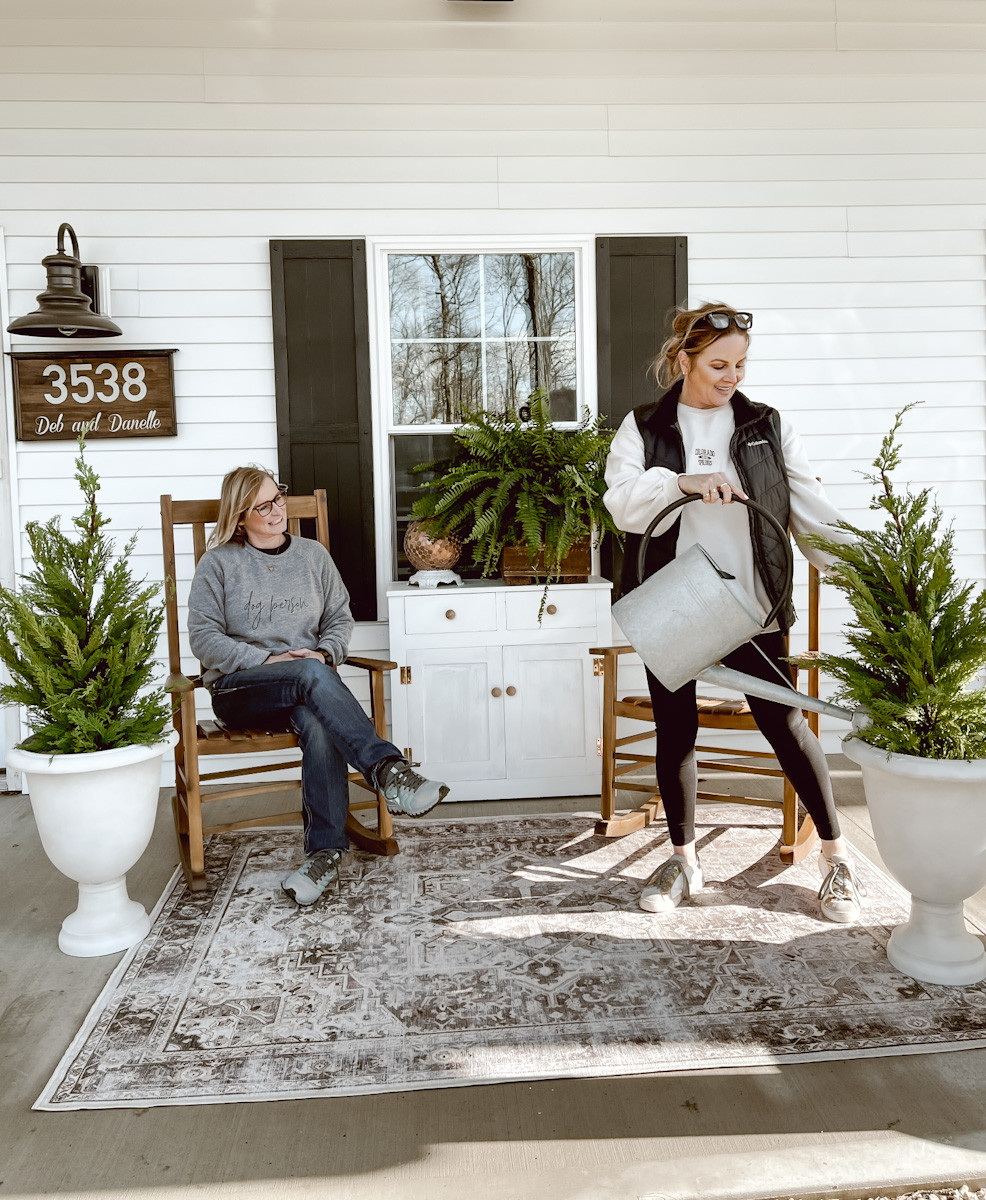Here is a throwback front porch look with these simple rocking chairs, washable area rug, and simple planters.  

 #LTKSeasonal #LTKHome