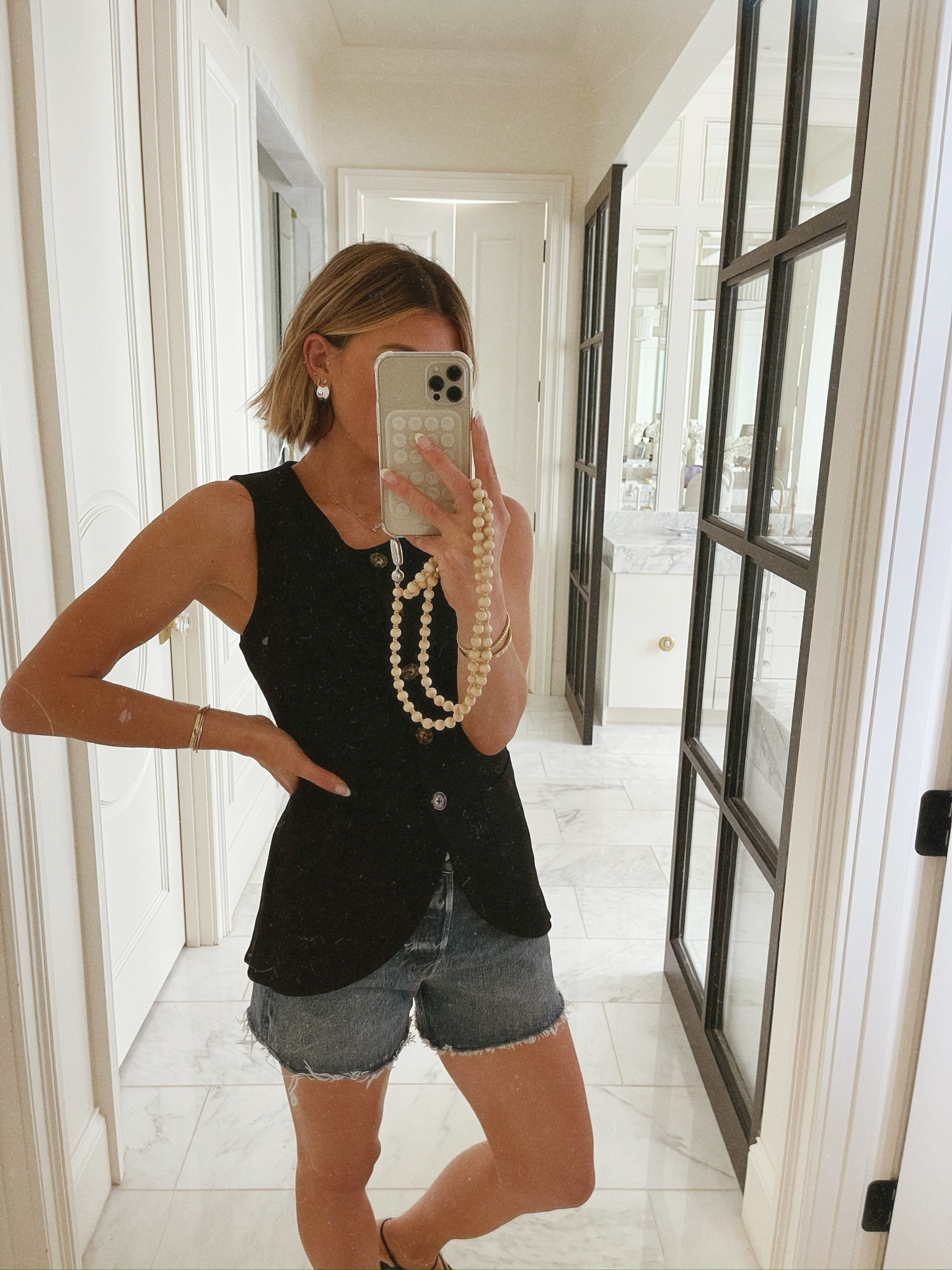 Easily dress up denim shorts with this black vest for summer! #ootd

#LTKSeasonal #LTKStyleTip