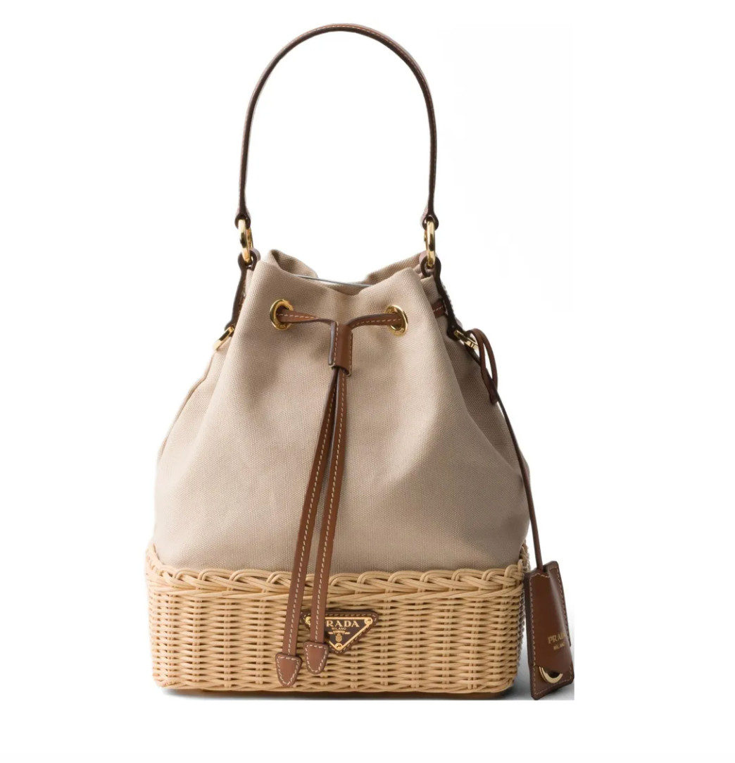 Elevate your summer style with this wicker and canvas bucket bag from Prada. The perfect blend of natural texture and luxury design, this bag adds a chic, effortless touch to any warm-weather outfit.

✨ Tap to shop this luxury summer bag & save for outfit inspo 

 #LTKdayinmylife #LTKgrwm #LTKootd