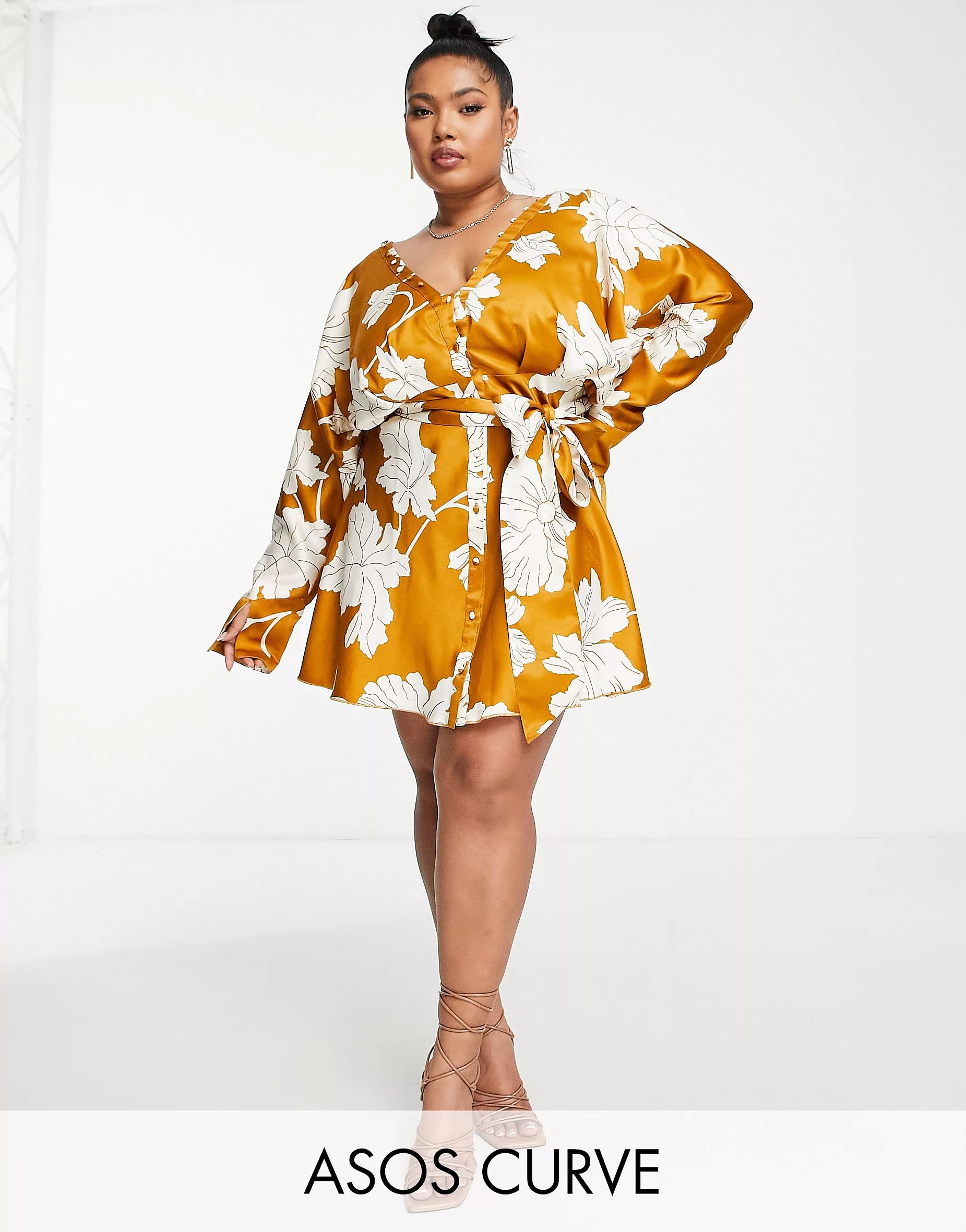 ASOS DESIGN Curve satin batwing mini dress with button front detail and tie front in mustard flor... | ASOS (Global)