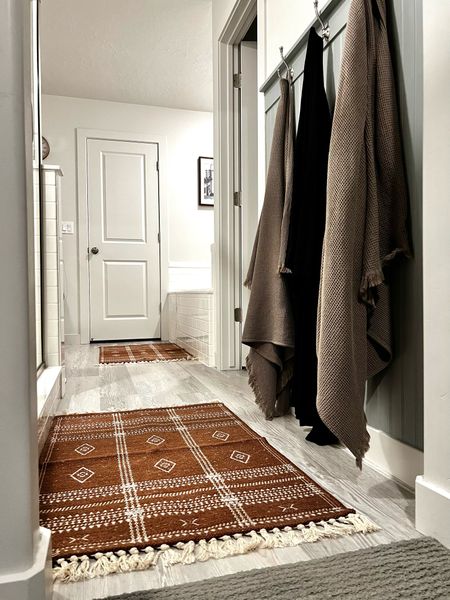 Got these accent rugs with non-slip backing to use as bath mats and so far I have no regrets! The size is working so well and they don’t slip all over the floor like our old mats did. I also love that deep terra cotta clay color to contrast with all the white in here. 

Bathroom styling
Bathroom rug
Primary bathroom

#LTKhome #LTKfindsunder50 #LTKSeasonal
