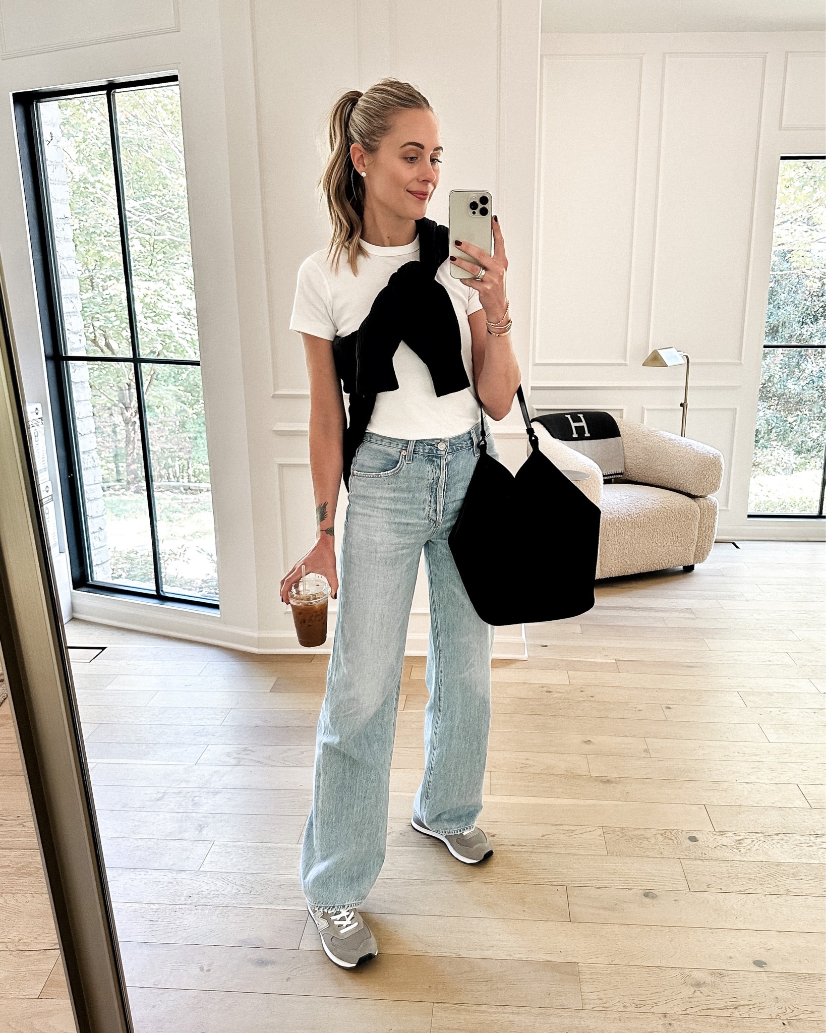 Fashion Jackson wearing white tshirt (small), wide leg jeans (tts) black sweater, new balance 574 sneakers (grey/tts), khaite hobo bag, casual outfit, sneaker outfit, weekend outfit 

#LTKshoecrush #LTKstyletip #LTKunder100